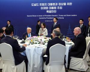 An intimate dinner party at the Apec conference in South Korea, featuring US President Donald...