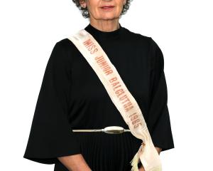 The present-day Debbie Webster (nee Hurring) dons her Miss Junior Balclutha winner’s sash once...