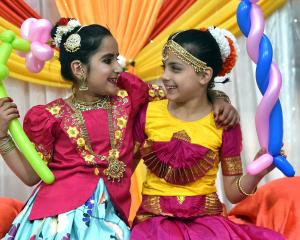 Enjoying the light and colour of Dunedin’s Diwali festival are Andersons Bay School pupils Vedika...