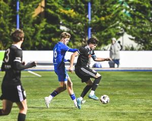 Christchurch United and Coastal Spirit captains Jago Godden and Joe Hoole clash during the sides'...