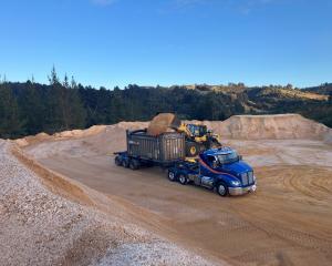 The processed sand is loaded into an open-top container at Walton Park. PHOTOS: SUPPLIED