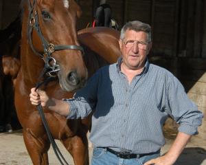Ten-race winner Sand Sweeper and proud trainer Hec Anderton. Photo: ODT files