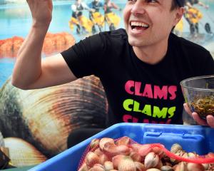 Southern Clams domestic sales and marketing manager Richard Ellwood prepares to take a bite of...