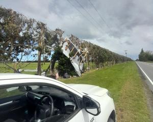 Roofing material blown across Oxford Rd. Photo: Waimakariri District Council 