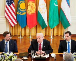 President Trump, flanked by Vice President JD Vance (left) and Secretary of State Marco Rubio sit...