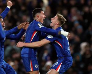 Chelsea striker Liam Delap (right) celebrates scoring his side’s third goal with team-mate Enzo...