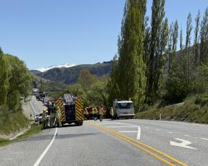 Emergency services at the scene of the crash in Gibbston Valley today. Photo: Still Vision...