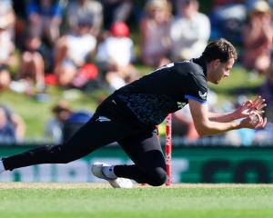 Black Caps fast man Jacob Duffy takes a low return catch to dismiss the West Indies’ Shamar...