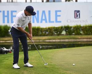 New Zealand’s Steven Alker putts on the 18th green during the Charles Schwab Cup tournament in...