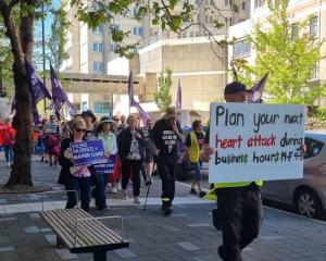 About 50 people marched through Dunedin as part of the Hīkoi for Our Health. Photo: RNZ