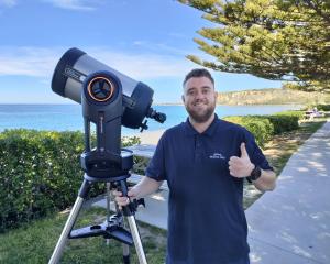 Bradley McConville sets up his solar telescope along the Kaikōura beachfront for viewing the sun....
