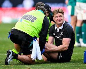 Jordie Barrett gets treated for an injury during the All Blacks match against Ireland on Sunday...