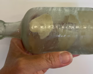 The Esperance family who found the bottle had to use tweezers to remove the letter. Photo:...