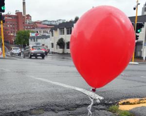 A red balloon tied to a stormwater drain in MacLaggan St. PHOTO: STEPHEN JAQUIERY