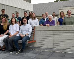 People who work in or alongside catchment restoration groups in Otago stand behind (seated, from...