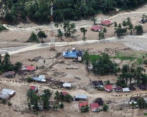 A mosque stands at an area hit by deadly flash floods in Palembayan in Indonesia's West Sumatra...