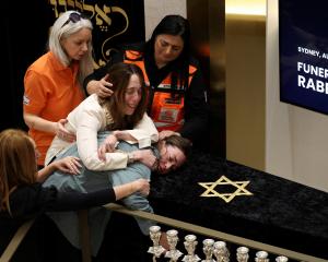 Family members farewell Rabbi Eli Schlanger, who was killed in the Bondi shootings on Sunday....