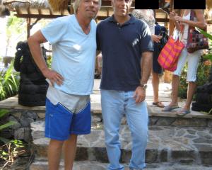 Jeffrey Epstein and Richard Branson are seen in this image released by the Department of Justice...