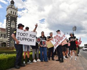 Career firefighters and supporters from across Dunedin gather at the Dunedin Railway Station...