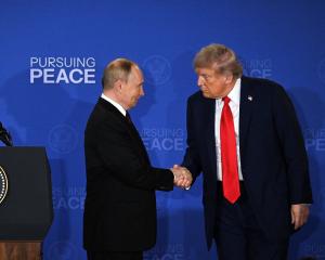 Peace on whose terms? Vladimir Putin and Donald Trump. PHOTO: REUTERS