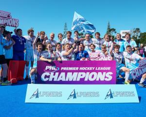 The Alpiners men celebrate victory in the Premier Hockey League final at Lloyd Elsmore Park in...