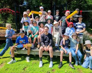 Gathering with Broad Bay School pupils and teacher Daniel Ashton is cricket stalwart Hamish...