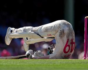 Australian captain Steve Smith falls over during his innings that yesterday saw him score his...