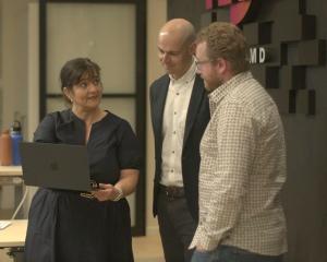 Custom D chief executive Julie Ryan talks to colleagues marketing head Matthew Rhodes (centre)...