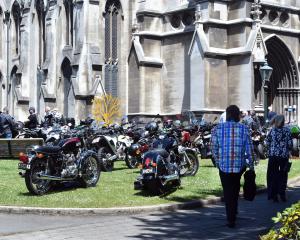Motorcycles parked outside First Church in Dunedin as mourners gather to farewell former city...