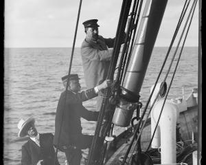 Climbing the rigging of SS Mapourika are (from top to bottom) Charles Houghton Mills, Captain...