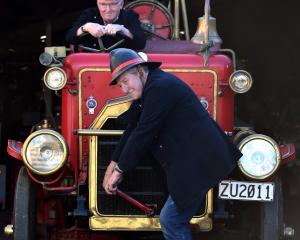 Norm Oakley gets ready to drive his family’s 1916 Dennis fire engine while Dunedin Fire Brigade...