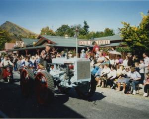  A photo shows participants in one of the early Arrowtown Autumn Festival street parades passing...