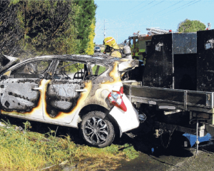 Ashburton firefighters at a car fire on the corner of Boundary Rd and Longbeach Rd. PHOTO: SUPPLIED