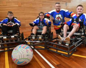 Dunedin Dragons Powerchair Football Club members (from left) Harrison Carter, 9, Stanley Smith,...