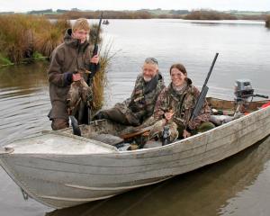 Celebrating a fresh bag of Tuakitoto-sky-kai in a past season were (from left) Alex Bishop,...