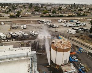 A drone view shows water being sprayed during the incident in Garden Grove, California. Photo:...