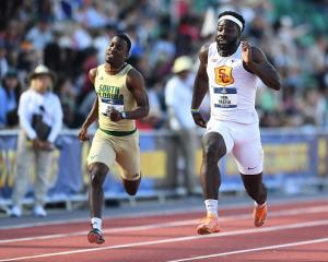 Eddie Nketia (right) runs at the NCAA division one national track and field championships in...