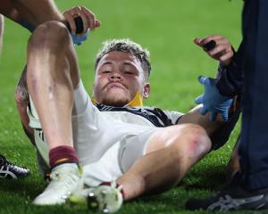 Caleb Tangitau leaves the field injured during the round 14 Super Rugby match between Chiefs and...