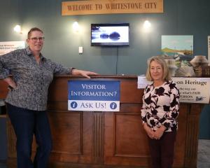 Oamaru and Waitaki Visitor Information Centre manager Carolyn Lewis (centre) and visitor...