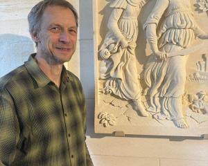 Stonemason, artist and sculptor Marcus Wainwright stands beside Judith (2007) in Mahika Kai...