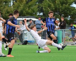 Christchurch United’s Phoenix Coursey puts in a tackle during his side’s clash with Selwyn United...