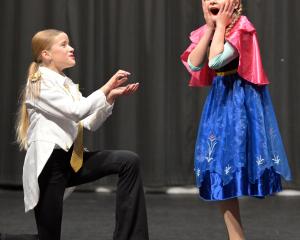 Sia Stevenson (left) and Isabelle Geary compete in the U12 open song and dance duo at the King’s...