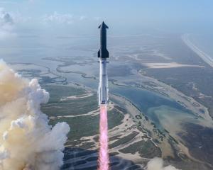 A SpaceX Starship and Super Heavy launches from the Starbase site in Texas on May 22.  PHOTO:...
