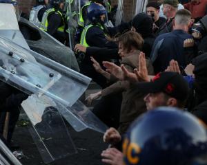 Protesters clash with police officers during a demonstration in Southampton following the...