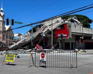 This building housing a Jollibee restaurant collapsed following the quake in General Santos....
