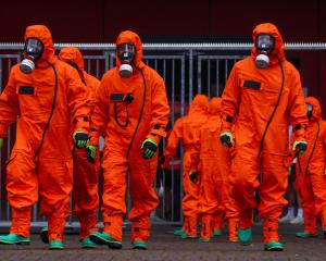 Members of German emergency services exercise for chemical, biological, radiological and nuclear ...