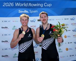 Oliver Welch (left) and Ben Taylor celebrate their gold medal at the Seville round of the world...