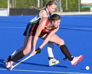 Ava Wiegersma (Momona) is challenged by Mckaela Woodward (Kings United Royals) at the McMillan...