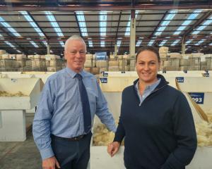 PGG Wrightson South Island wool auctioneer Dave Burridge with the company's general manager of...
