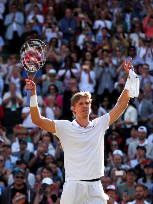 Kevin Anderson celebrates knocking Roger Federer out. Photo: Reuters 